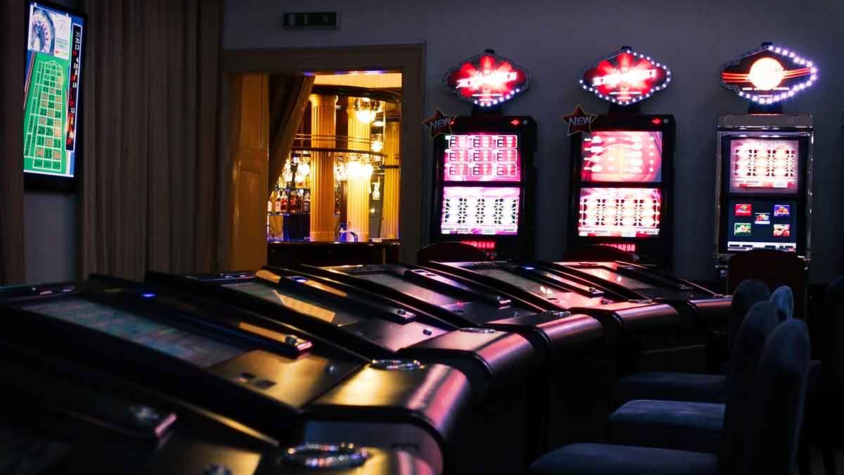 A room with casino machines and slots machines