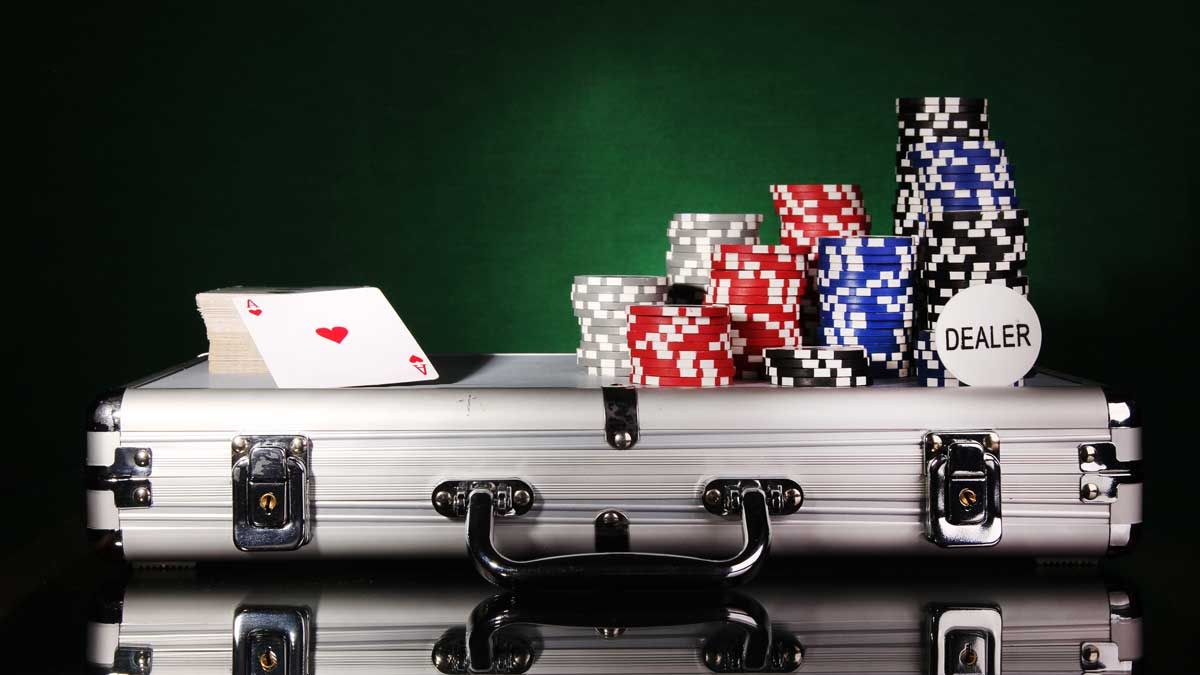 A poker case with poker chips and a deck of cards