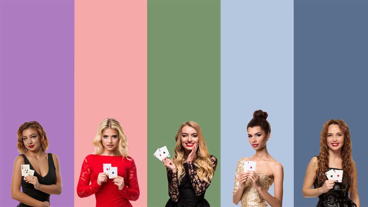 Women holding two aces