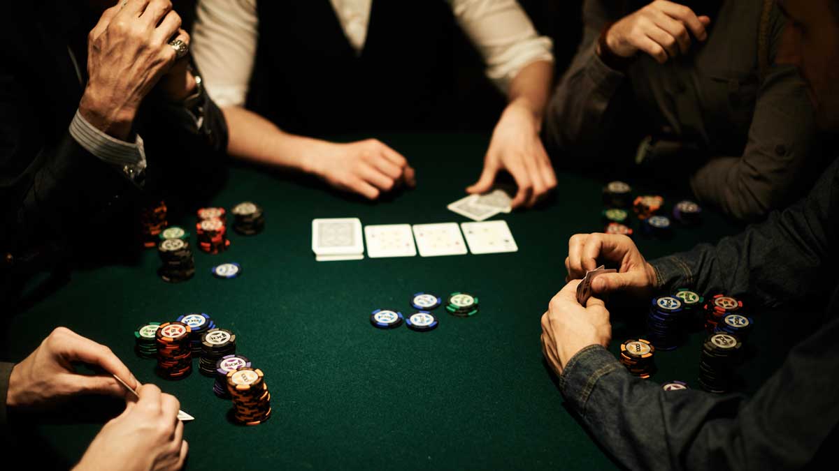 A group of people playing poker