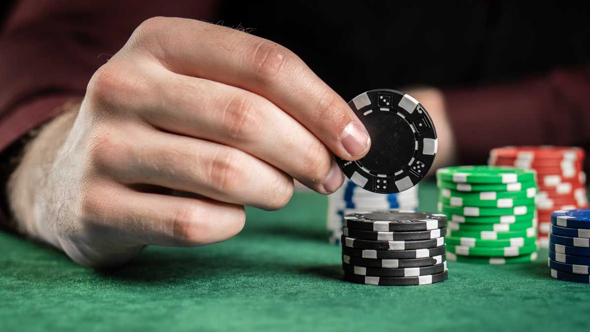 Man with stack of chips