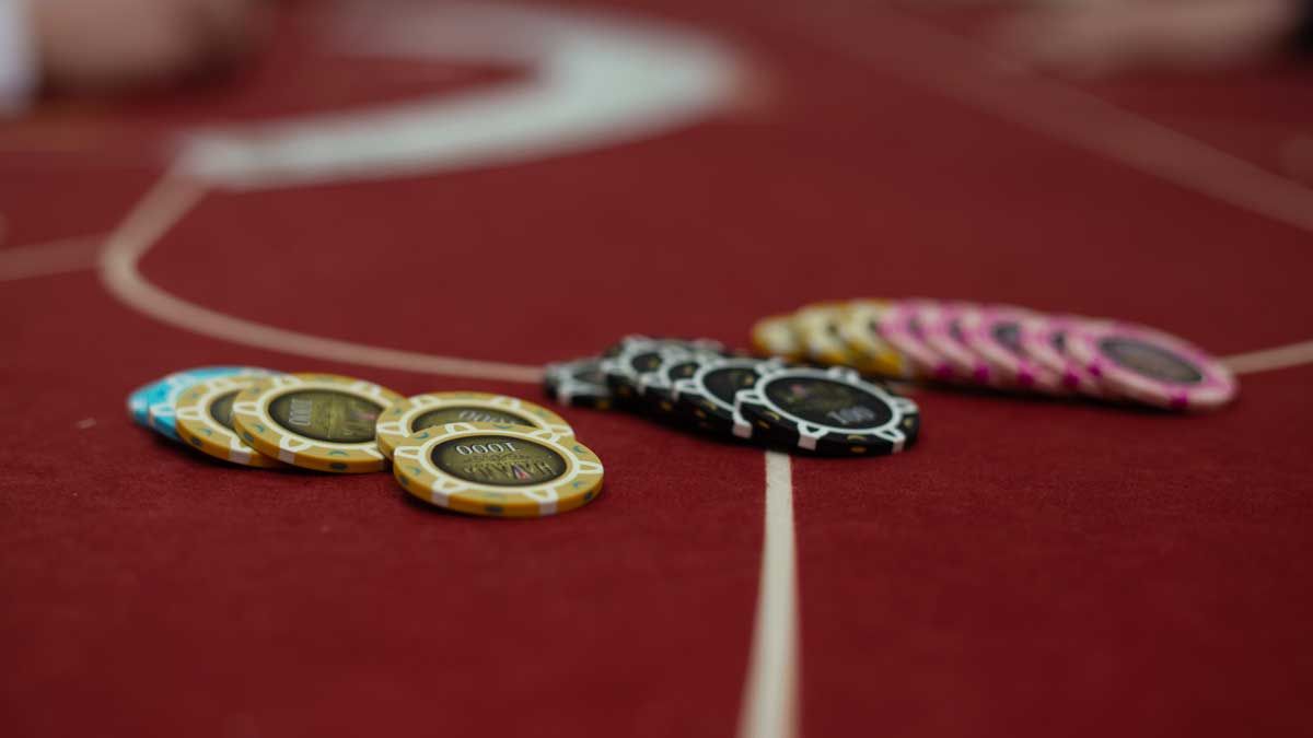 Spin And Gold Poker Chips on table