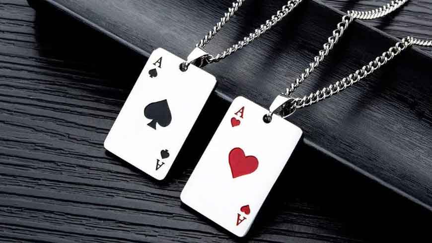 A pair of poker pendants